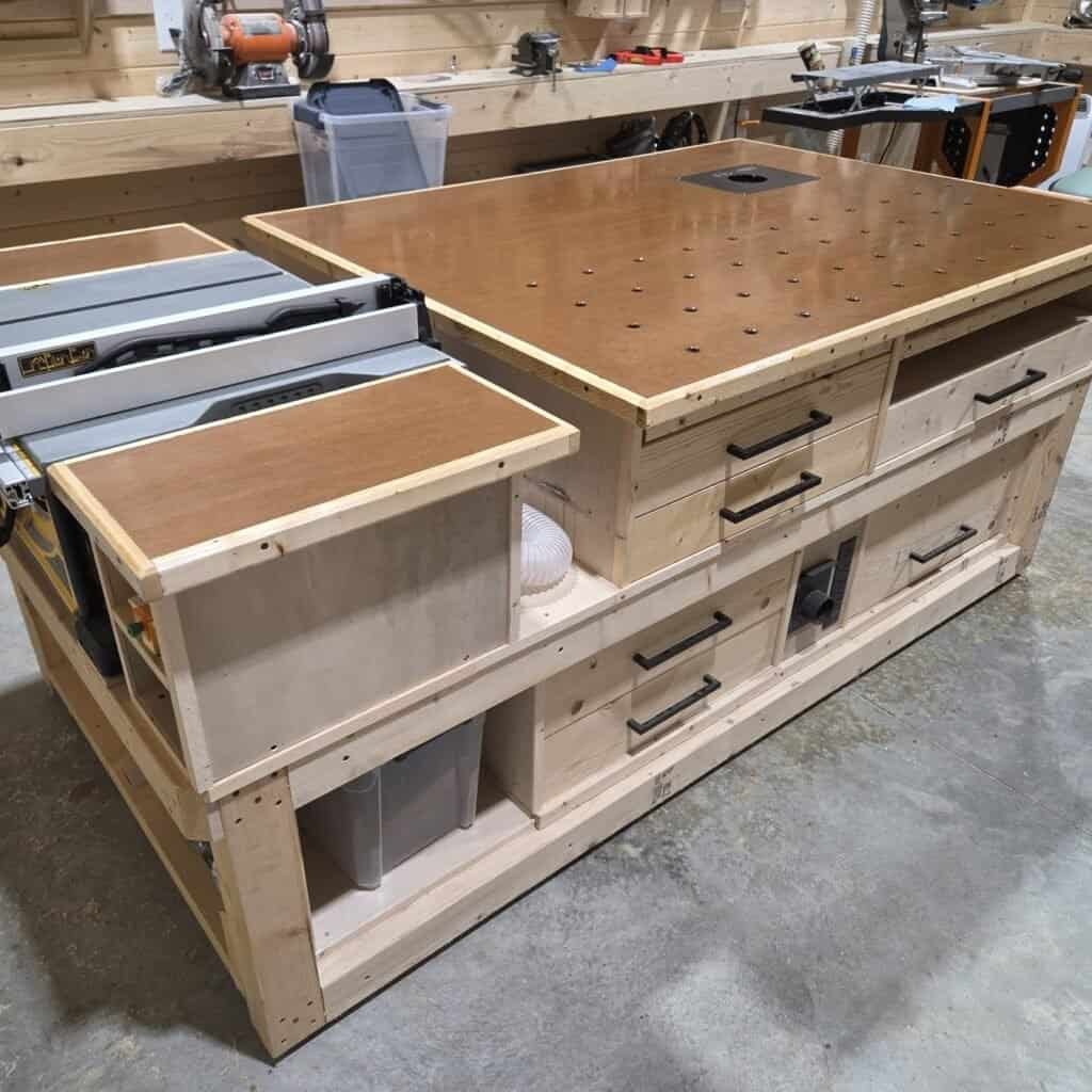 Mobile wood shop cart combining a table saw, router table, and built-in drawer storage